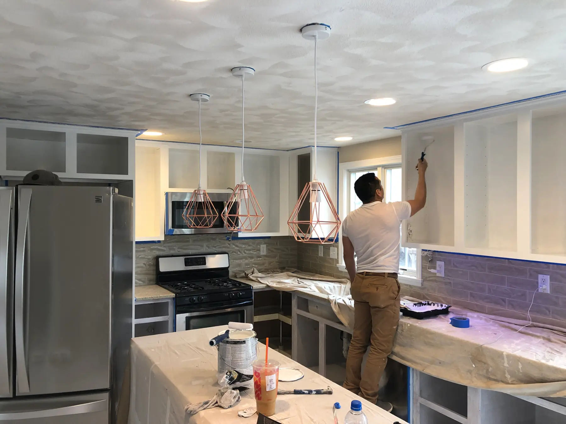Ivan working on the kitchen.